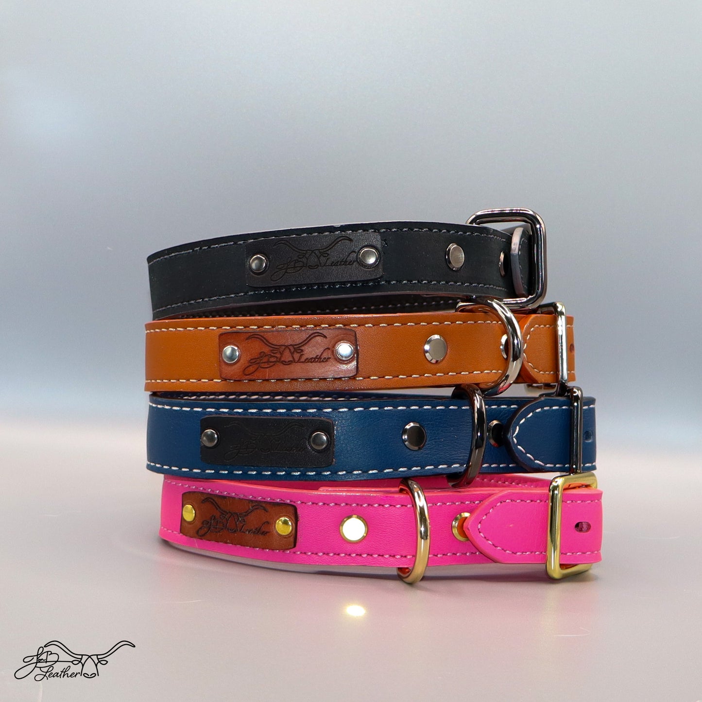 Handmade Luxe Pet Collars showing stitched leather and buckle detail stacked
