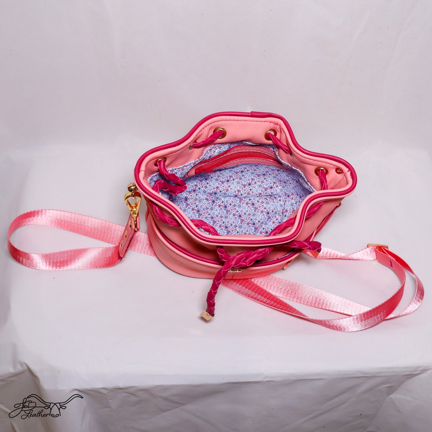 Open interior of Mini Drawstring Crossbody showing zipper pocket and lining