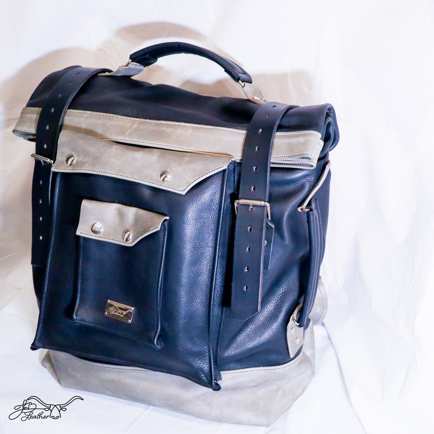 View of full grain leather texture on roll top leather backpack