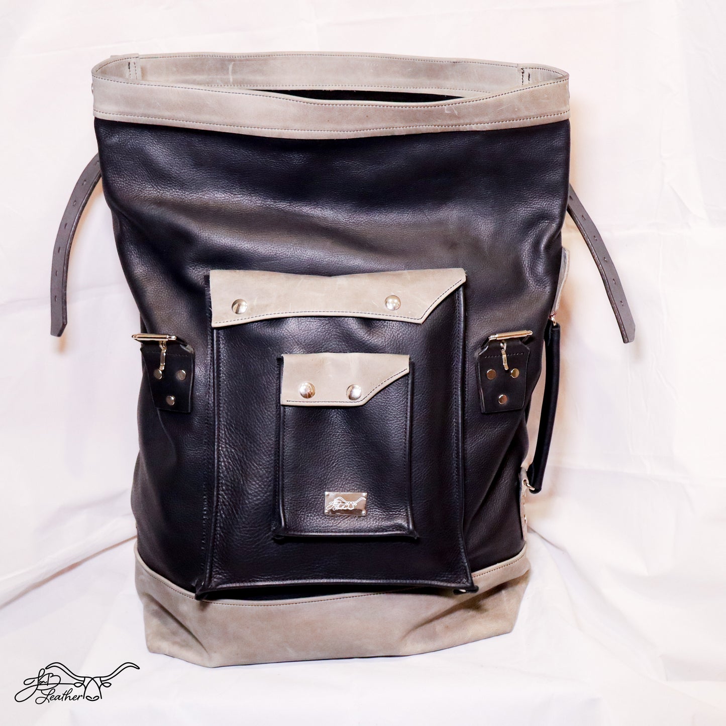 Large capacity leather rucksack with roll top closure open front view