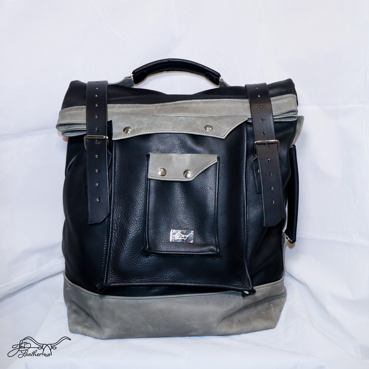 Large capacity leather rucksack with roll top closure