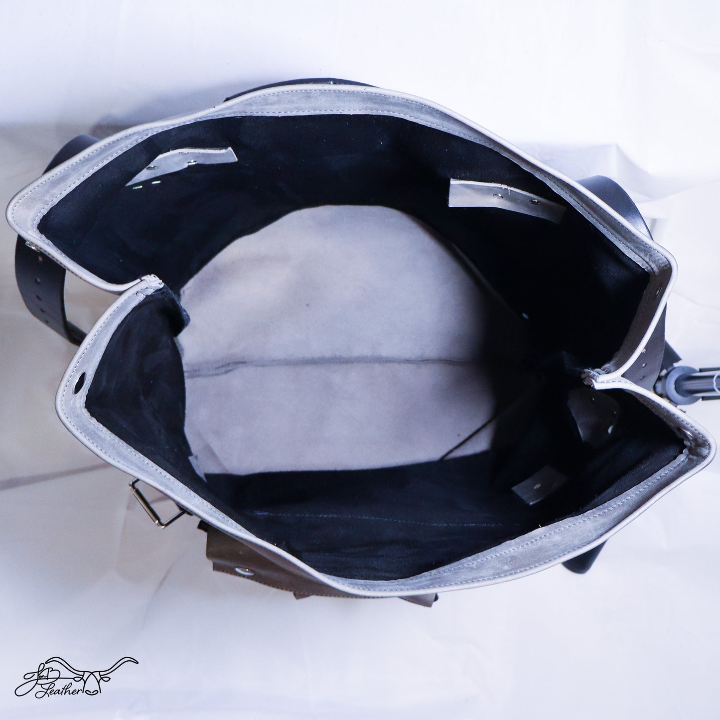 Large capacity leather rucksack with roll top closure open