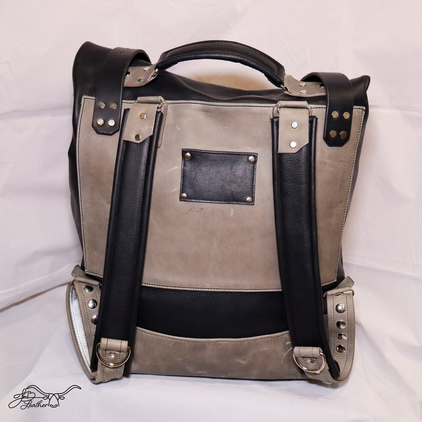 Handmade full grain leather backpack side profile with adjustable straps