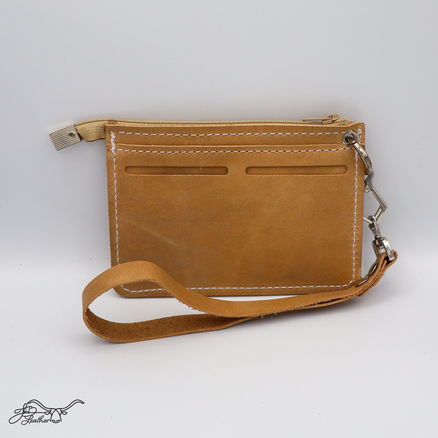 Handmade leather wristlet wallet showing exterior card slots