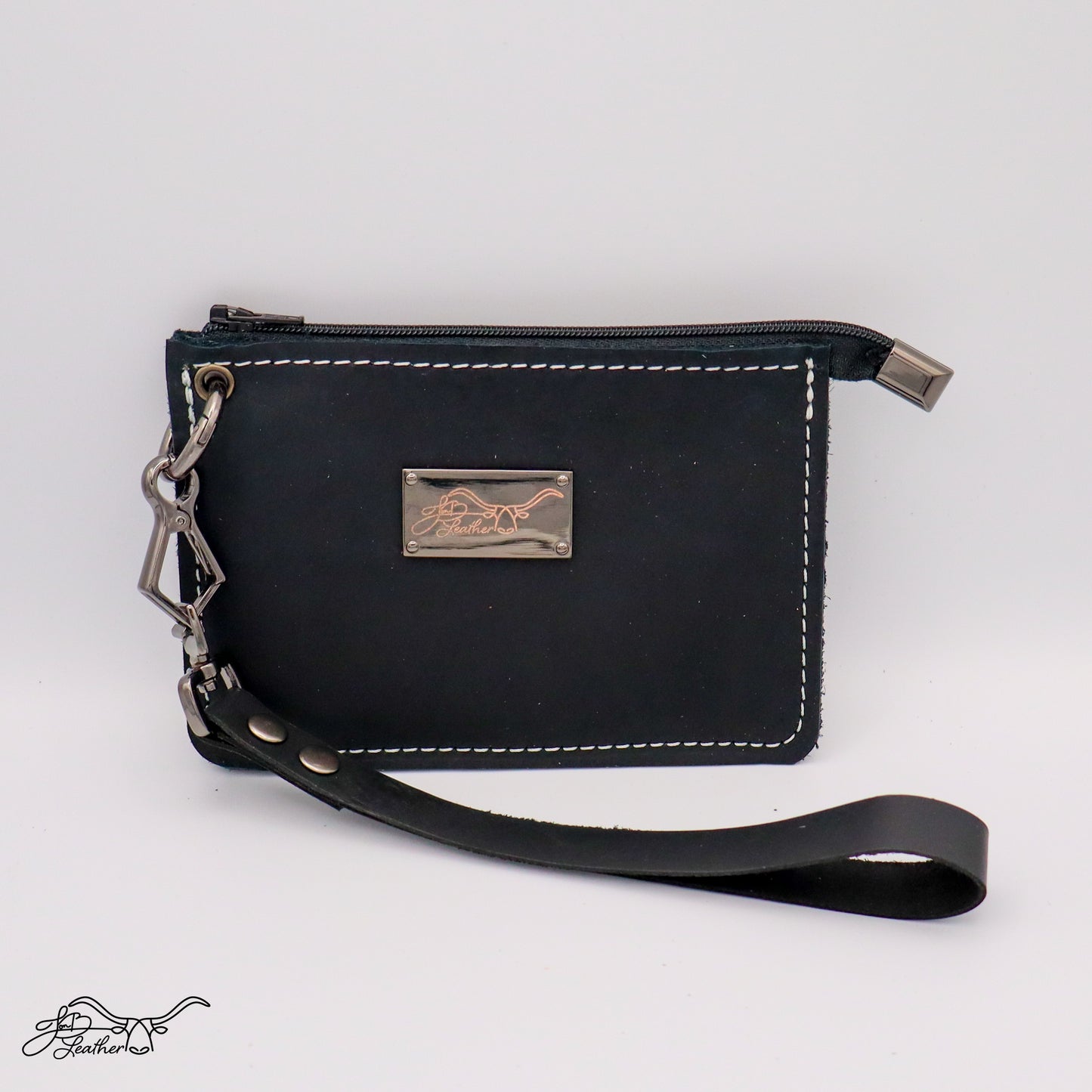 Close-up of leather wristlet wallet strap and stitching black