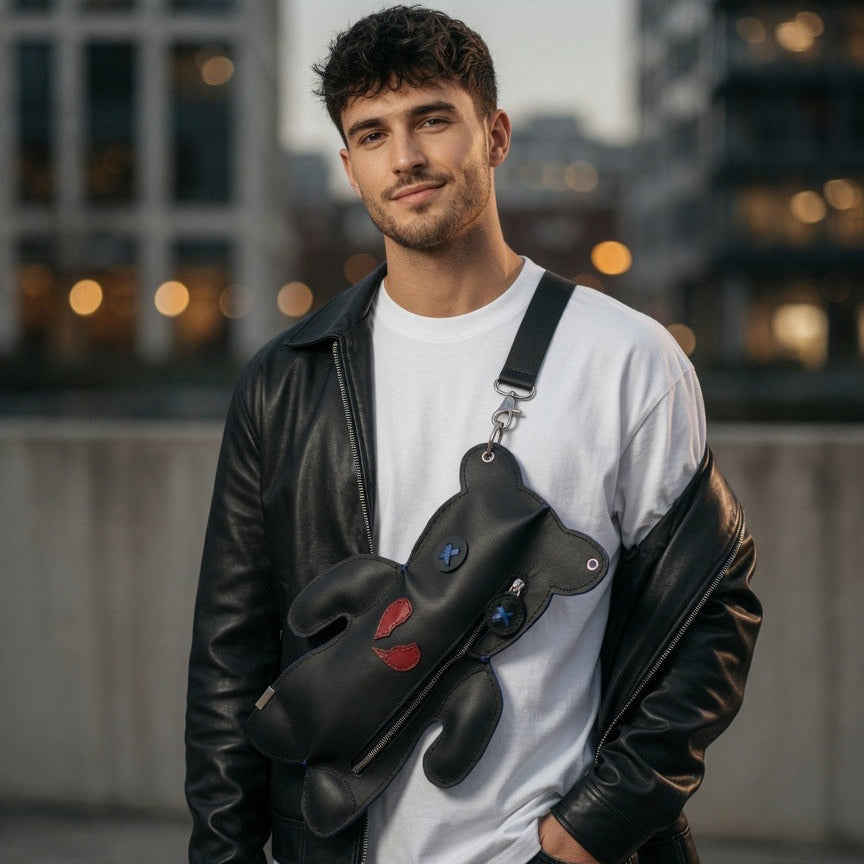 Broken Heart Bear Crossbody worn across the chest with a black strap