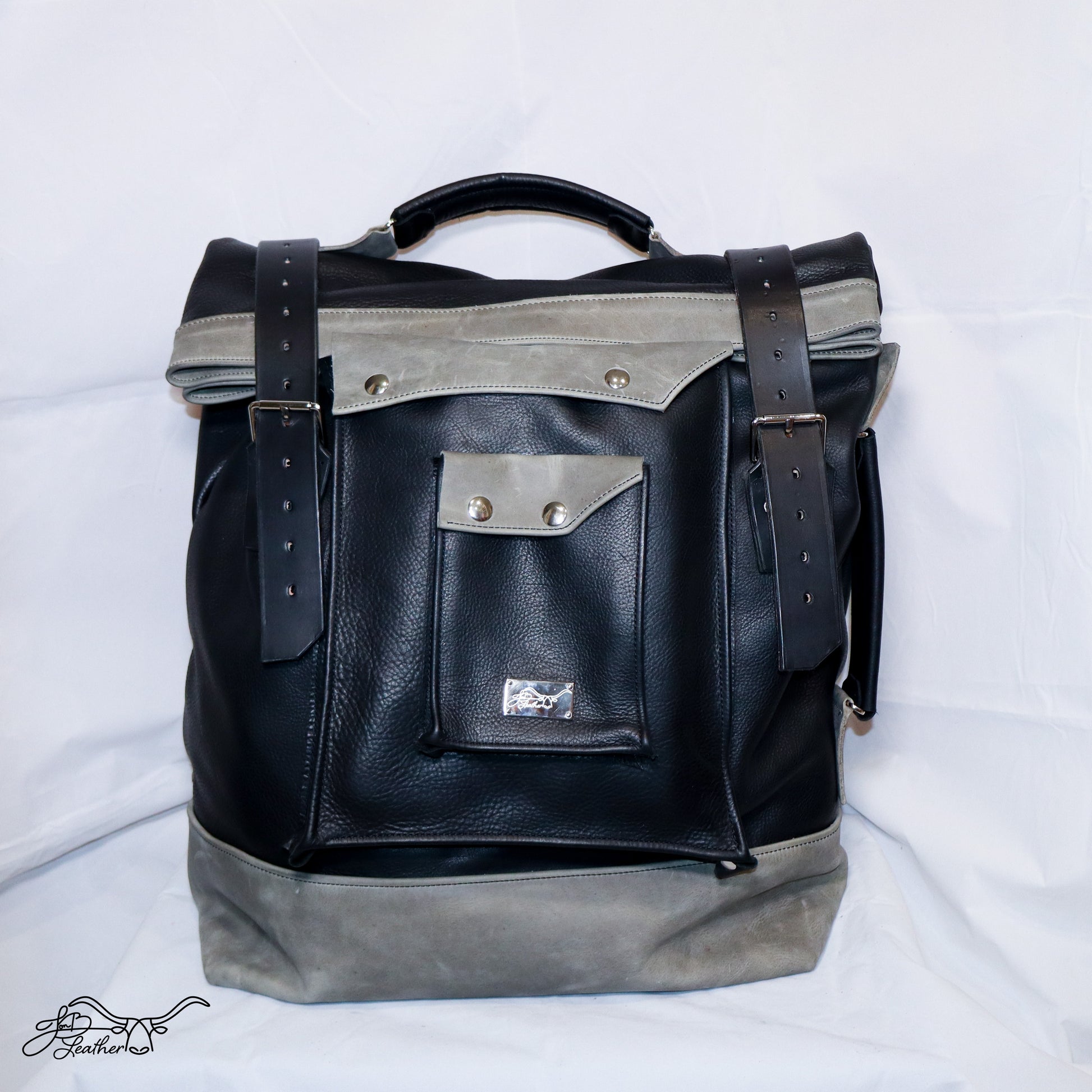 Large capacity leather rucksack with roll top closure