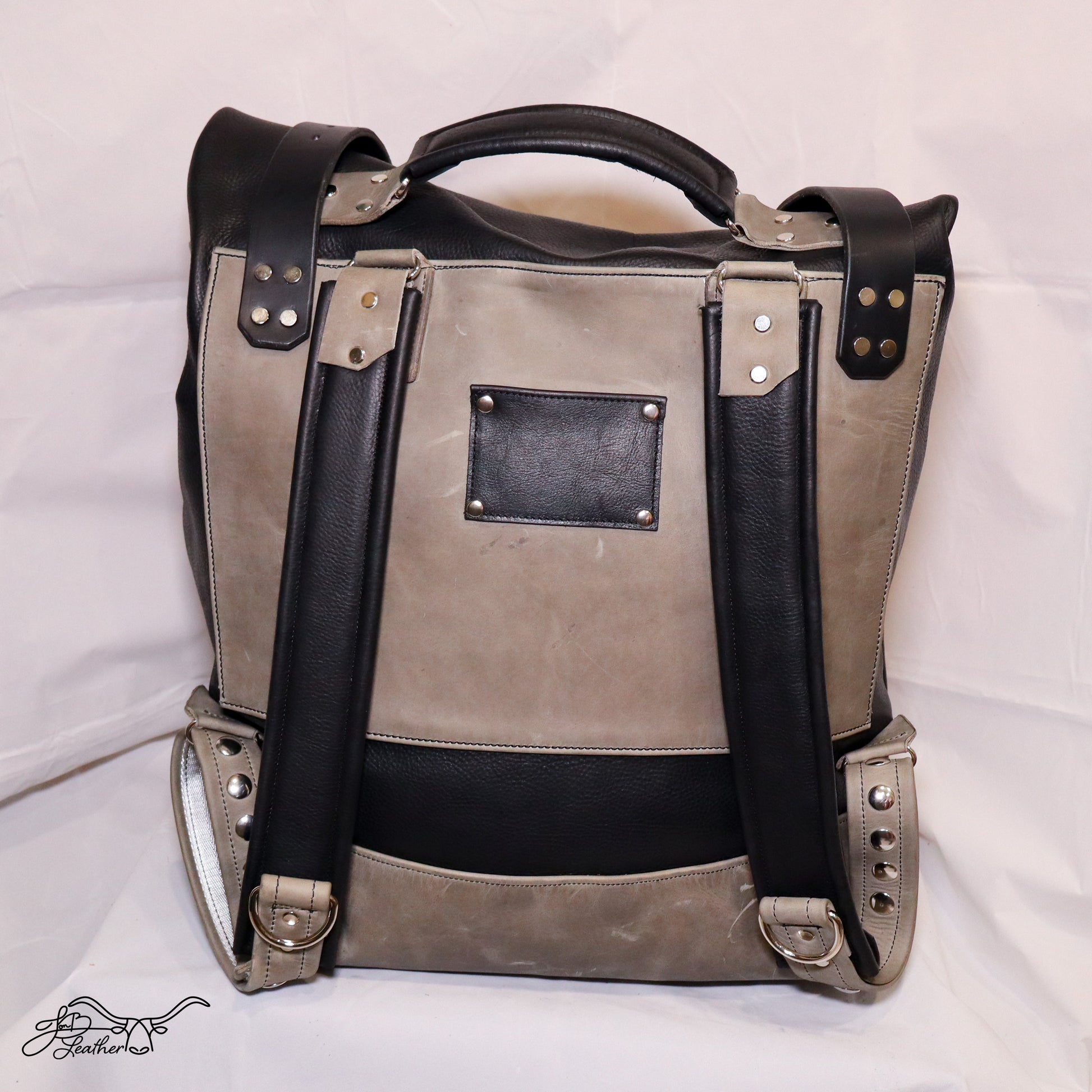 Handmade full grain leather backpack side profile with adjustable straps