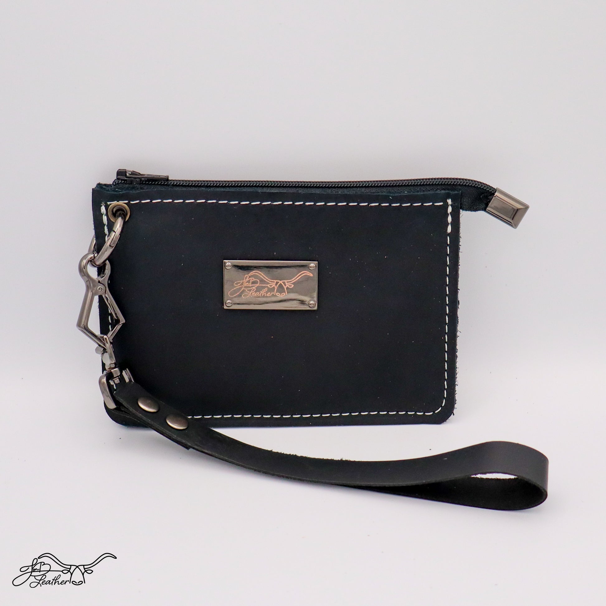 Close-up of leather wristlet wallet strap and stitching black